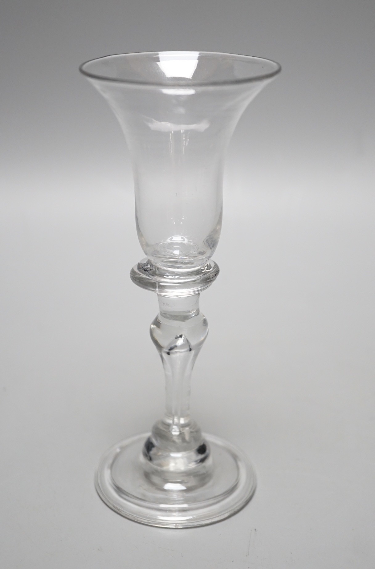 A George II wine glass with inverted teardrop baluster stem, 15.5cm tall